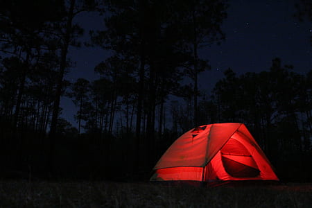photography of red dome tent during nighttime thumbnail