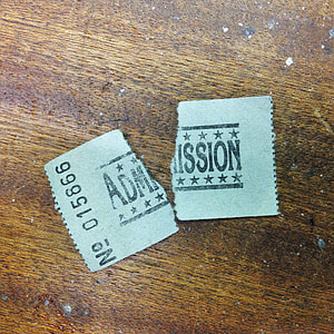 Admission ticket on beige surface thumbnail