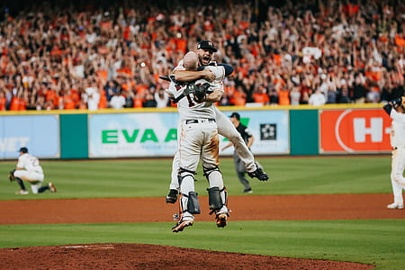 two baseball player hugging each other on field thumbnail