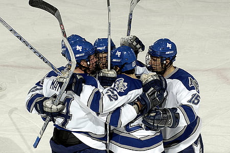 five ice hockey players at ice hockey arena thumbnail