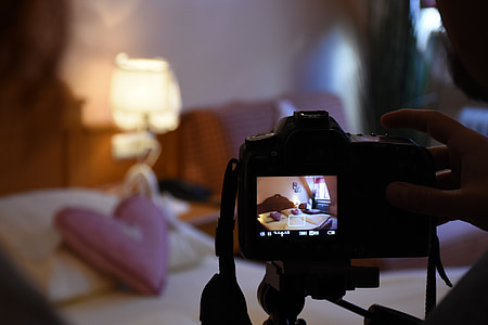 person taking photo of bed thumbnail