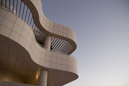 white concrete building under blue sky thumbnail