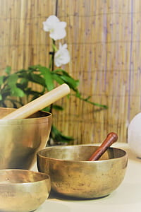 three pairs of singing bowls on beige surface thumbnail