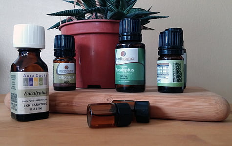 six dropper bottles on brown surface thumbnail