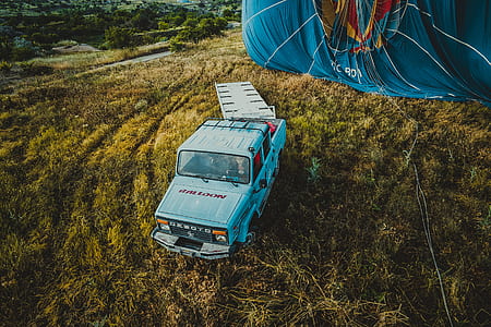 aerial view of white Desoto AS250 truck on brown field thumbnail