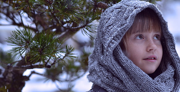 girl with blond bangs wearing gray scarf outside during winter thumbnail