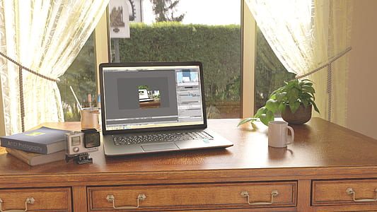 gray laptop computer turned on thumbnail