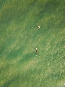 people surfing during daytime thumbnail