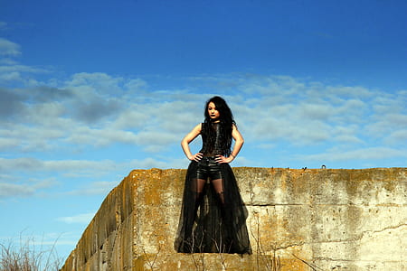 woman sitting on concrete platform thumbnail