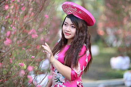 woman posing beside flowers thumbnail