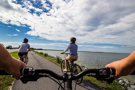 man driving bike during daytime thumbnail