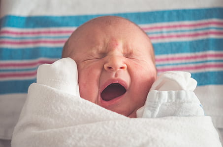 baby in blanket yawning thumbnail