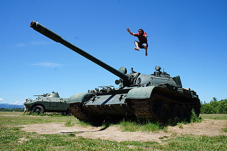 man jumps over battle tank thumbnail