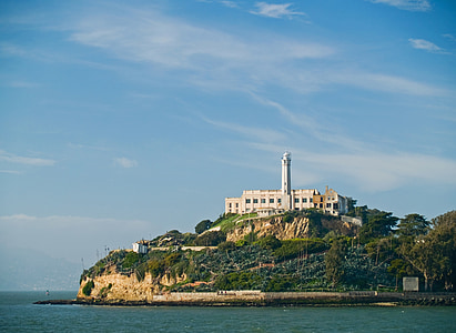 white concrete building on island during daytime thumbnail
