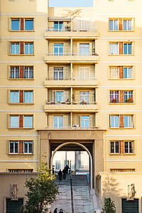 brown painted building during daytime thumbnail