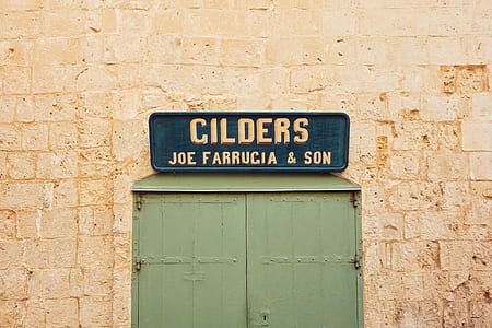 Cilders Joe Farrucia & Son signage on brown wall thumbnail