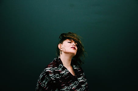 close-up photo of woman wearing white and black top thumbnail