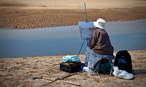 woman wearing jacket painting at daytime thumbnail