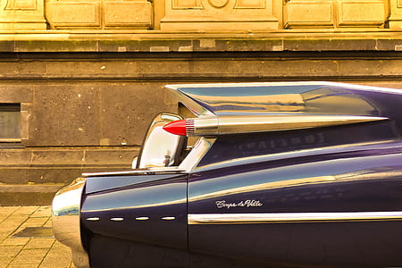 closeup photography of classic Cadillac Coupe de Ville during daytime thumbnail