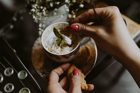 Coffee in a decorative cup with a golden ornament thumbnail
