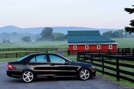 Black Coupe Near Black Wooden Fence during Daytime thumbnail
