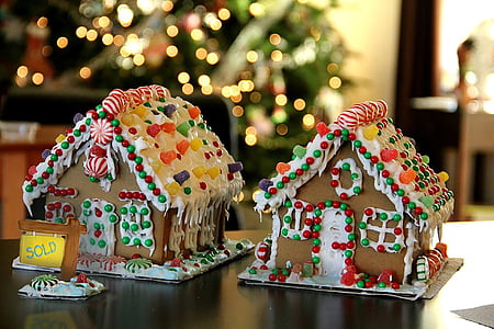 two ginger bread houses on brown tables thumbnail