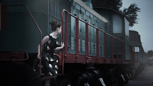 photo of woman standing on train stair thumbnail