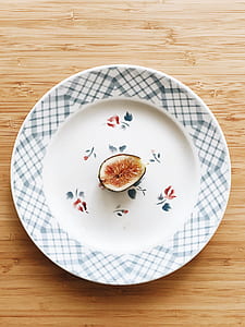 sliced fig fruit on white ceramic plate thumbnail