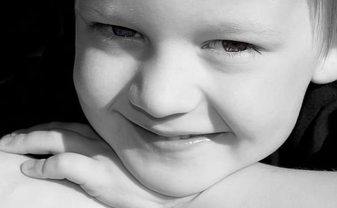 grayscale photo of boy face thumbnail