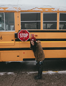 woman standing in front of school bus thumbnail