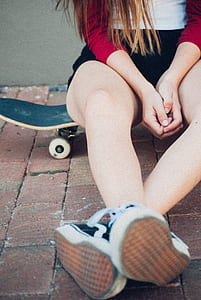 woman sitting on skateboard thumbnail