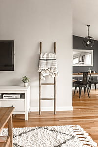 brown wooden 4-layer leaner rack near side table thumbnail