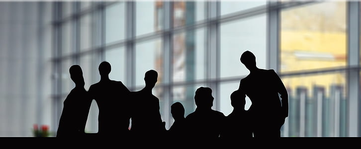 silhouette of people behind glass panel window thumbnail