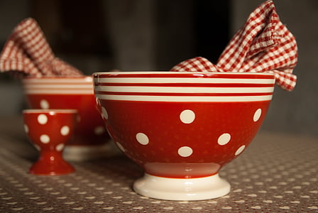 close-up photography of red-and-white polka-dot ceramic bowls thumbnail