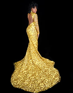 photo of woman wearing yellow and black open back lace long-sleeved dress thumbnail