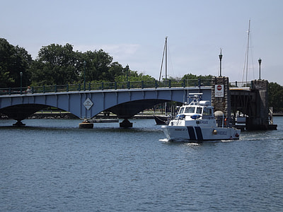 white tugboat near the bridge thumbnail