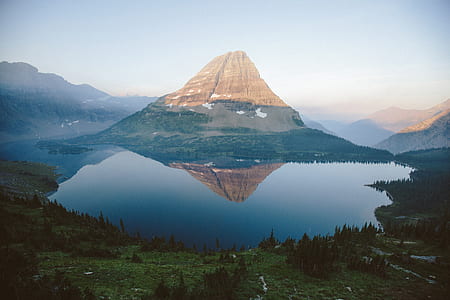 landscape photography of mountain and body of weater thumbnail
