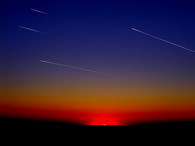 shooting stars photo during sunset thumbnail