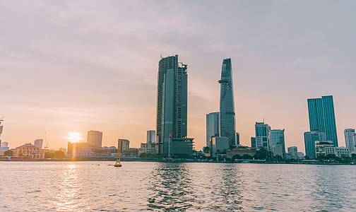 High-rise Buildings Near Sea Taken Under White Clouds thumbnail