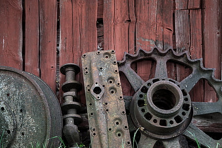 gray metal tool components on wooden surface thumbnail