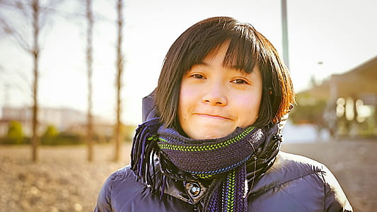 woman in fringe scarf and purple jacket during daytime thumbnail
