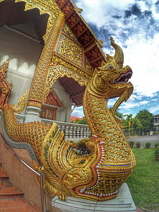 gold dragon statue near temple thumbnail