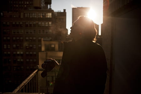 man holding DLSR camera thumbnail