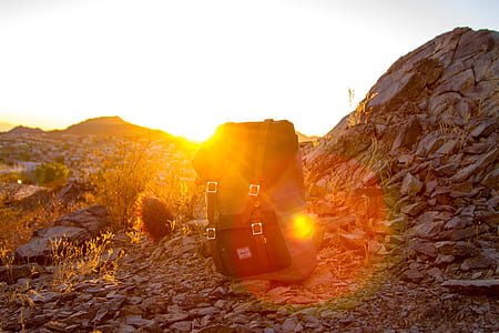black and gray Herschel backpack on mountain thumbnail