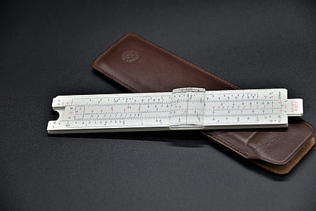 white ruler with brown case thumbnail