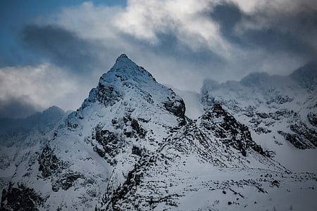 snow covered mountain under blue sky at daytime thumbnail