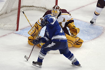 two men playing ice hockey thumbnail
