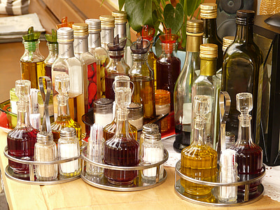 assorted-color glass bottle lot on beige surface thumbnail