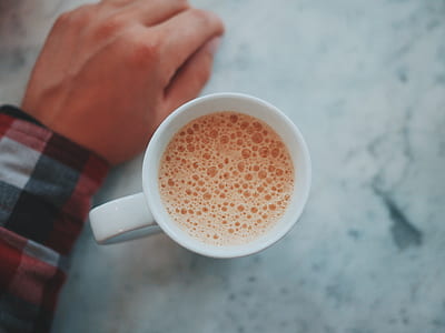 white ceramic mug on gray marble-top table thumbnail