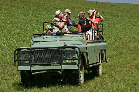 green Land Rover Defender SUV thumbnail